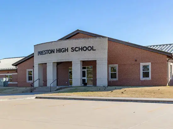 A building with the words preston high school on it.