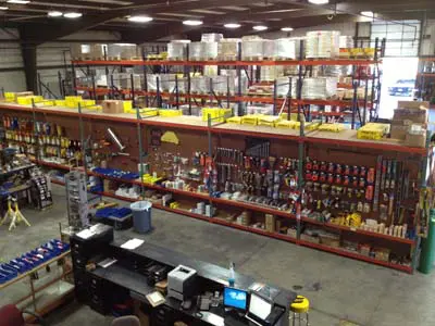 A warehouse filled with lots of shelves and racks.